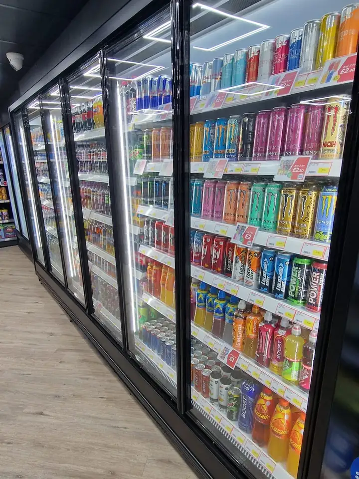 Long run of glass door fridges