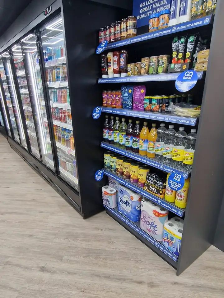 Display fridges beside gondola shelving