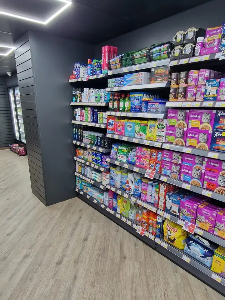 Gondola shop shelving stocked with snacks