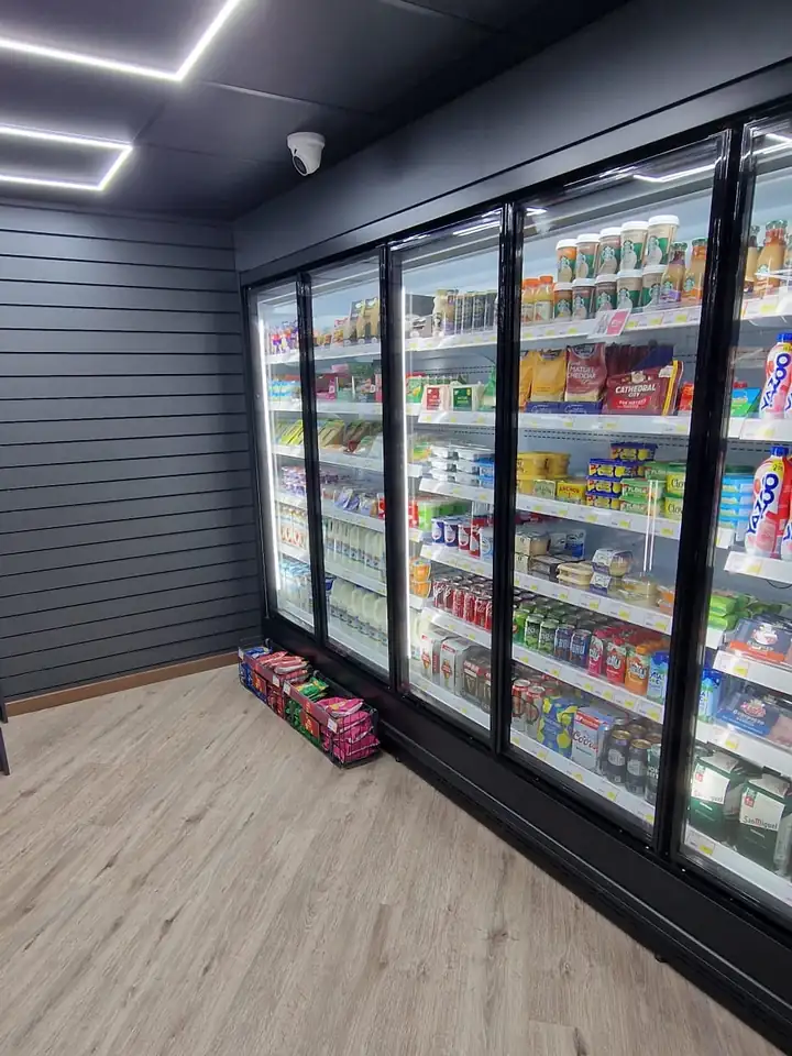 Run of glass door display fridges in a convenience store